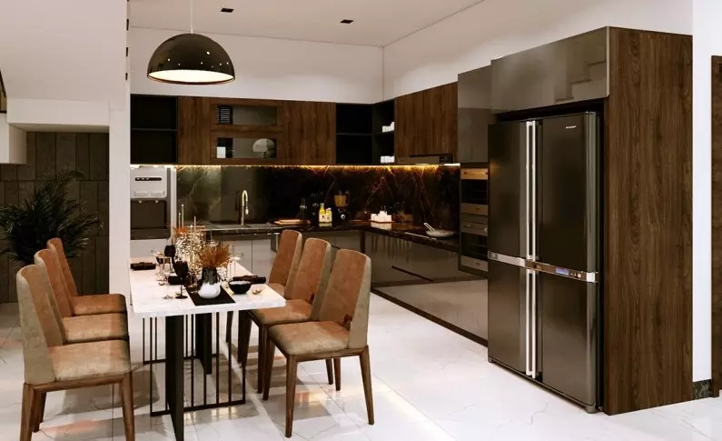 Phòng bếp có sự kết hợp tinh tế giữa hệ thống ánh sáng với nội thất gỗ Óc Chó trong nhà bếp càng được tôn lên vẻ đẹp vốn có